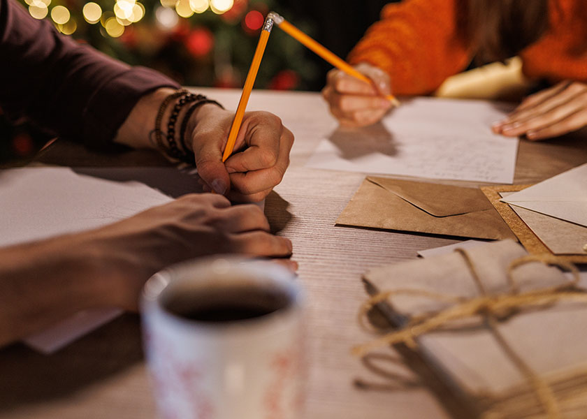 A stack of festive Christmas cards representing planning, preparation, and the importance of financial vision.